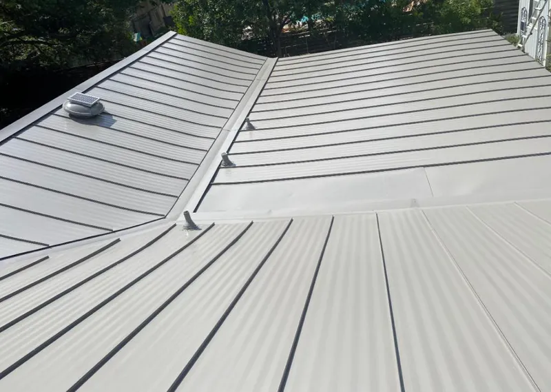 Solar attic fan installed on a metal roof for Roof Ventilation in Baldwin Park